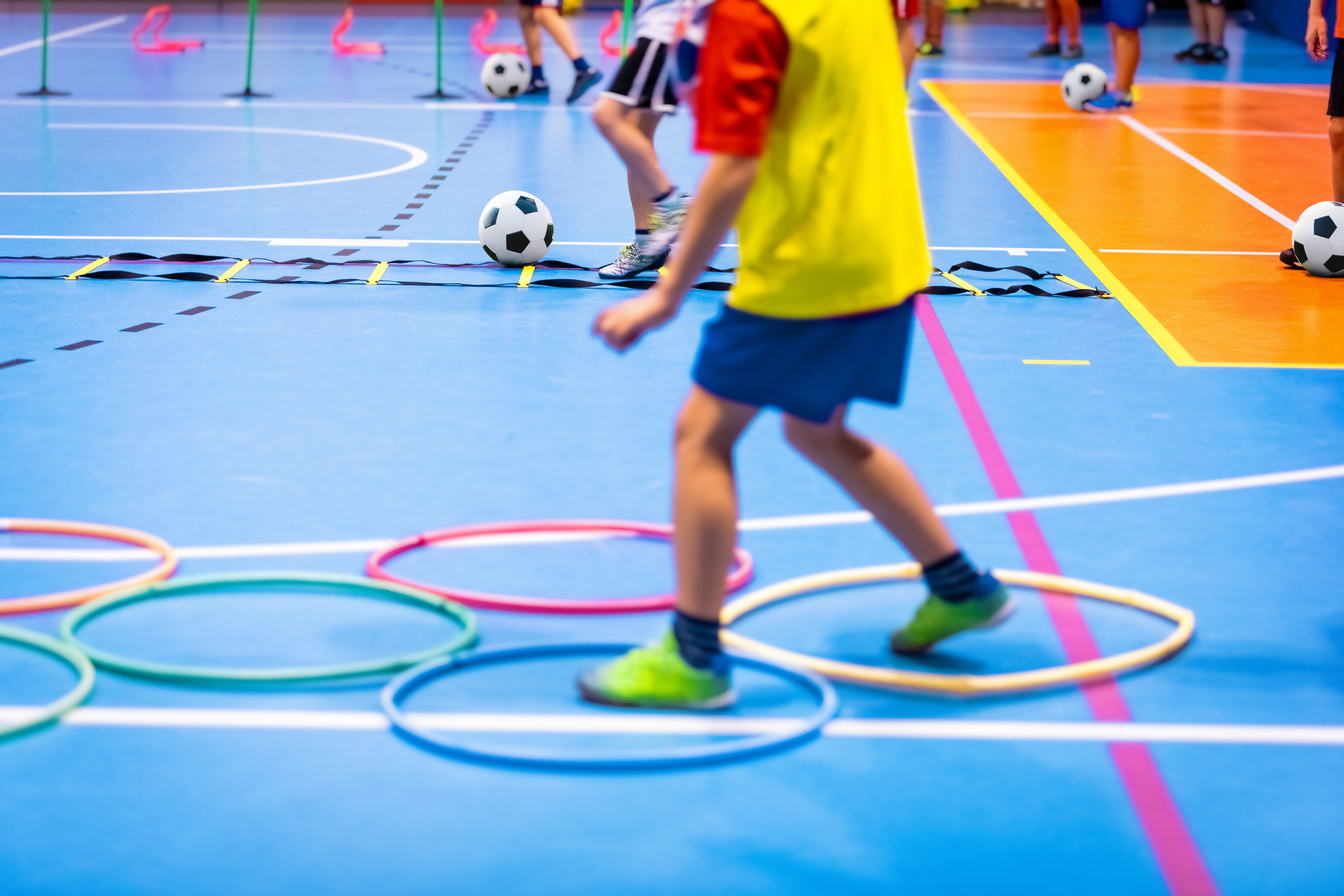 Indoor Soccer Class for Kids at School Sports Hall. Children Kic